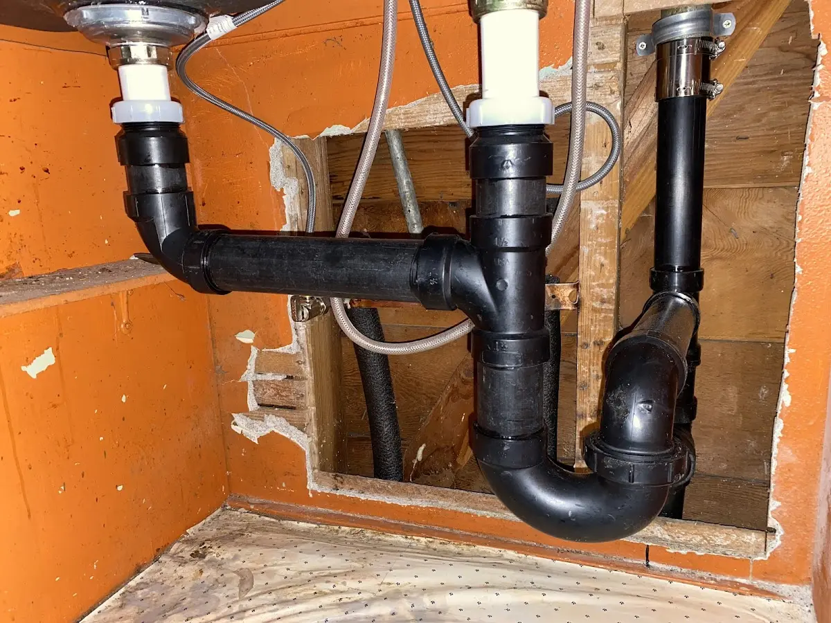 Professional Garbage Disposal Repair equipment and tools on the job in Edgewater